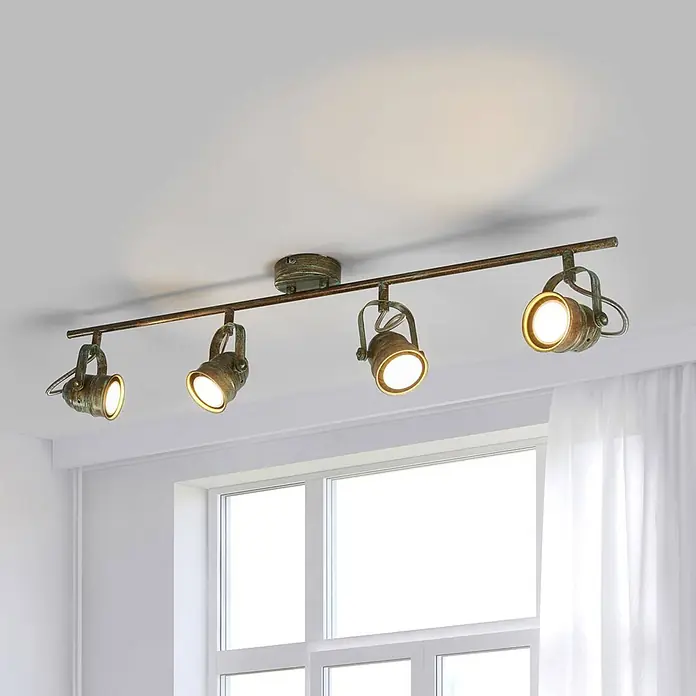 Lindby Deckenleuchte Leonor - bronze / altmessing, bronze / altmessing, GU10 - Deckenbalkenleuchte in Antikmessing-Optik mit vier verstellbaren Strahlern, die warmes Licht abgeben.