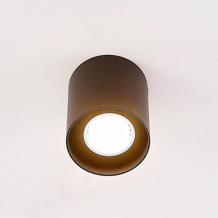 Arcchio Deckenleuchte Carson - schwarz, schwarz, GU10 - Zylindrische Aufputz-Deckenleuchte in Dunkelbronze mit goldenem Inneren und heller LED-Birne.