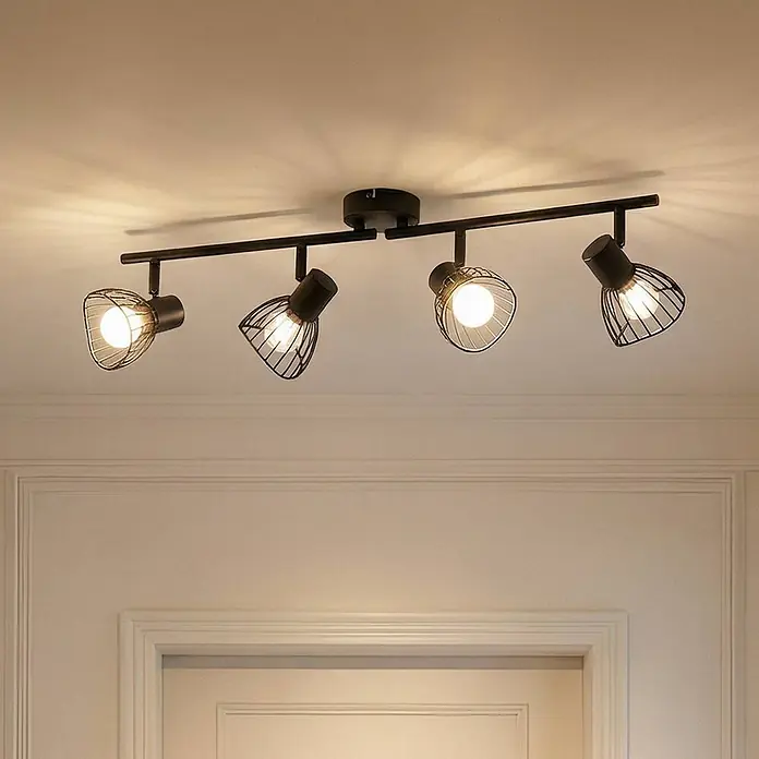 Lindby Deckenleuchte Piena - schwarz, schwarz, E14 - Schwarze Metall-Deckenschiene mit vier verstellbaren Strahlern, Gitterkörben, an einer Decke montiert, strahlt warmes Licht nach unten ab.