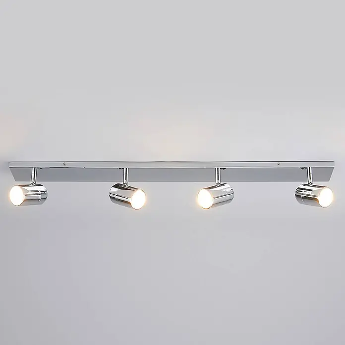Lindby Deckenleuchte Dejan - chrom / silber, chrom / silber, GU10 - Chrom 4-Flammen-Deckenstrahlerleiste mit allen Lichtern beleuchtet.