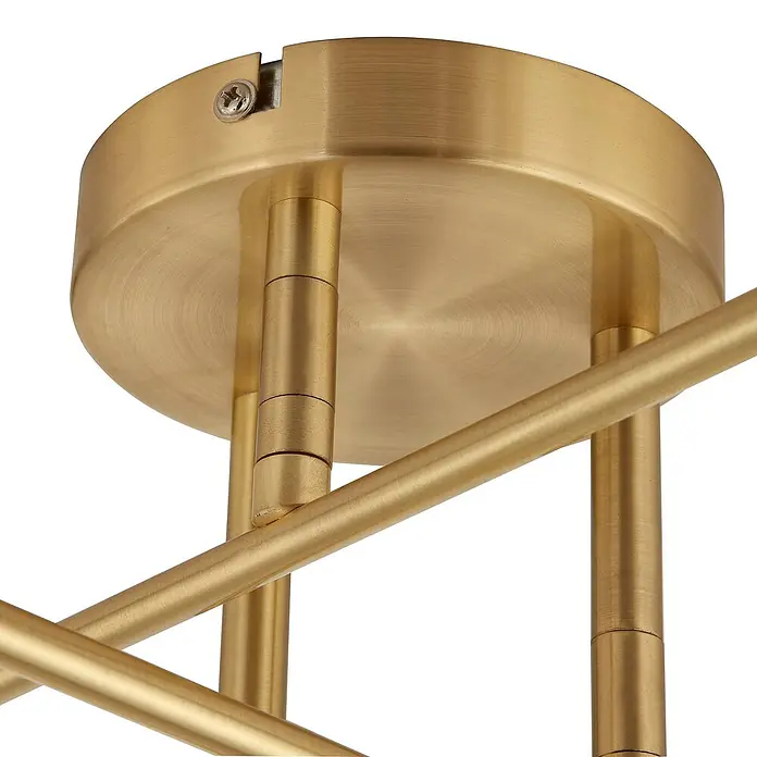 Lindby Deckenleuchte Aloria - messing / gold, E27 - Nahaufnahme einer Deckenhalterung aus gebürstetem Messing für eine Leuchte, mit mehreren goldenen Stangen, die nach unten ragen.