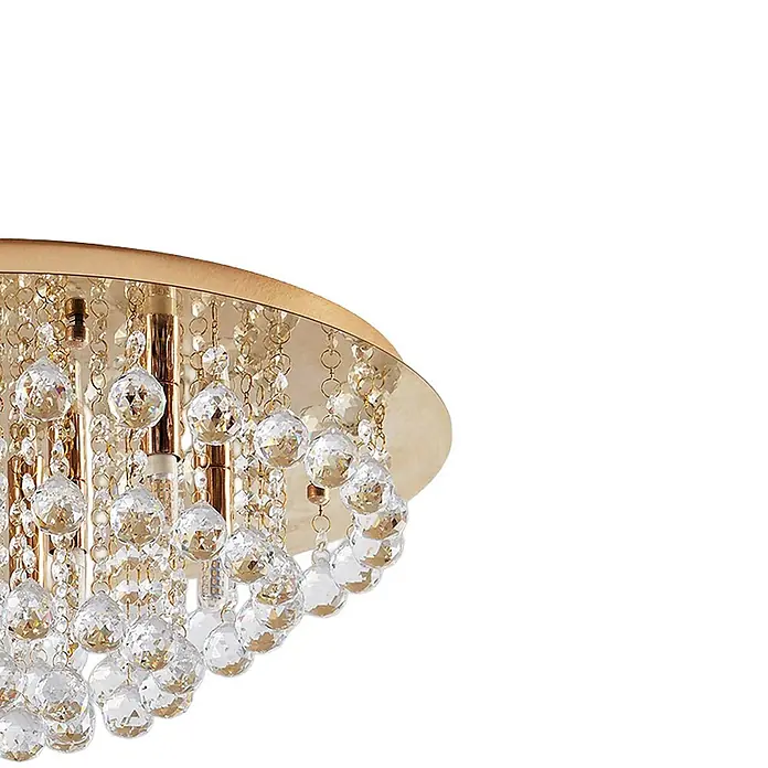 Lindby Deckenleuchte Gillion - L x B x H: 55 x 55 x 23,5 cm, messing / gold, klar / transparent, G9 - Goldfarbene Deckenleuchte mit mehreren klaren, facettierten Kristallkugeln, die von einer goldenen Halterung hängen.