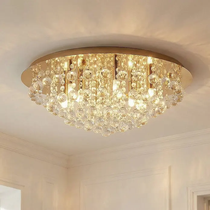 Lindby Deckenleuchte Gillion - L x B x H: 55 x 55 x 23,5 cm, messing / gold, klar / transparent, G9 - Elegante goldfarbene Kristall-Deckenleuchte mit zahlreichen klaren Kristallkugeln, die warmes Licht funkeln lassen.