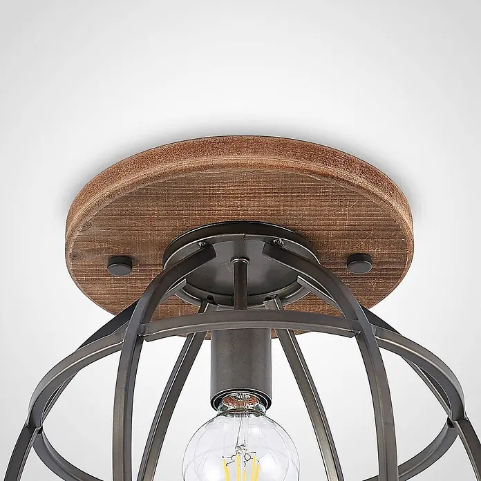 Lindby Deckenleuchte Rutger - Holz dunkel, schwarz, E27 - Rustikale Deckenleuchte mit runder, abgenutzter Holzbasis und offenem dunklen Metallkäfig um eine freiliegende Glühbirne.