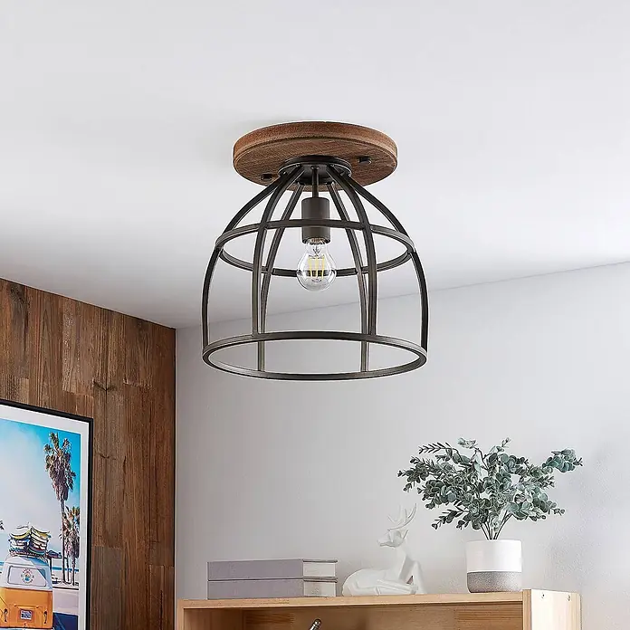 Lindby Deckenleuchte Rutger - Holz dunkel, schwarz, E27 - Eine rustikale Deckenleuchte mit runder Holzbasis und dunklem Metallkäfigschirm.