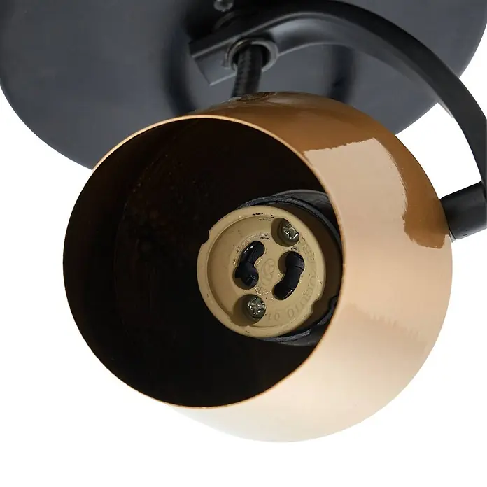 Lindby Deckenstrahler Sylveria - L x B x H: 7,5 x 7,5 x 14,5 cm, schwarz, messing / gold, GU10 - Nahaufnahme des Inneren eines bronzefarbenen Strahlers mit beiger Glühbirnenfassung und schwarzer Montagebasis.