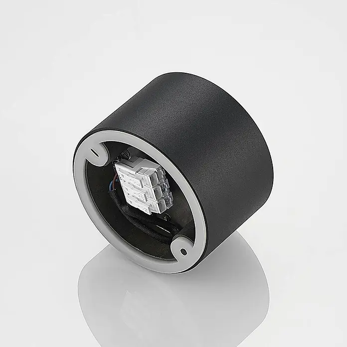 Arcchio Deckenstrahler Nieva - L x B x H: 10 x 10 x 6,5 cm, schwarz, schwarz, 2GX53 - Schwarze zylindrische Leuchte mit grauem Rand, zeigt interne elektrische Anschlüsse zur Installation.