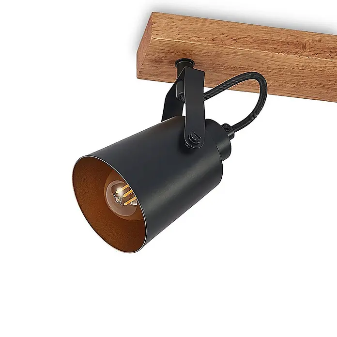 Lindby Deckenstrahler Kimban - L x B x H: 106,5 x 8,3 x 15,8 cm, Holz dunkel, schwarz, E14 - Schwarzer Metall-Deckenstrahler mit freiliegender Glühbirne, montiert an einem hellbraunen Holzbalken.
