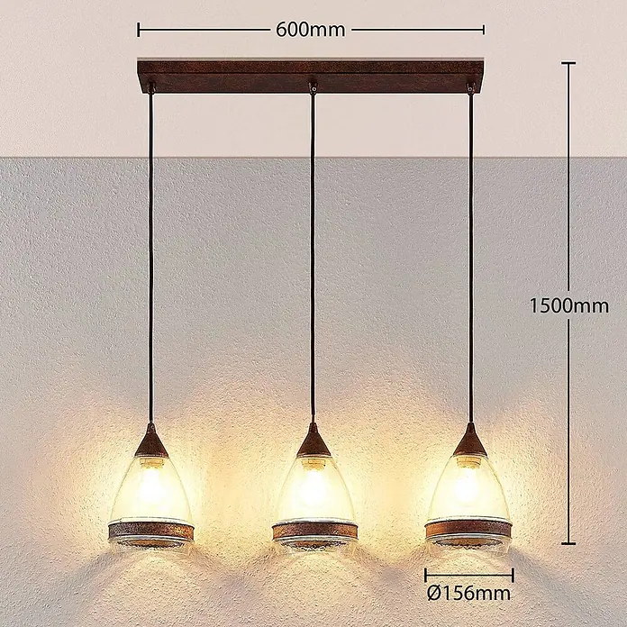 Lindby Pendelleuchte Millina - L x B x H: 70,4 x 15,6 x 25,8 cm, klar / transparent, rostbraun, klar, E27 - Dreiflammige Pendelleuchte mit dunkelbraunem Balken und klaren Glasschirmen mit rostfarbenen Bändern.