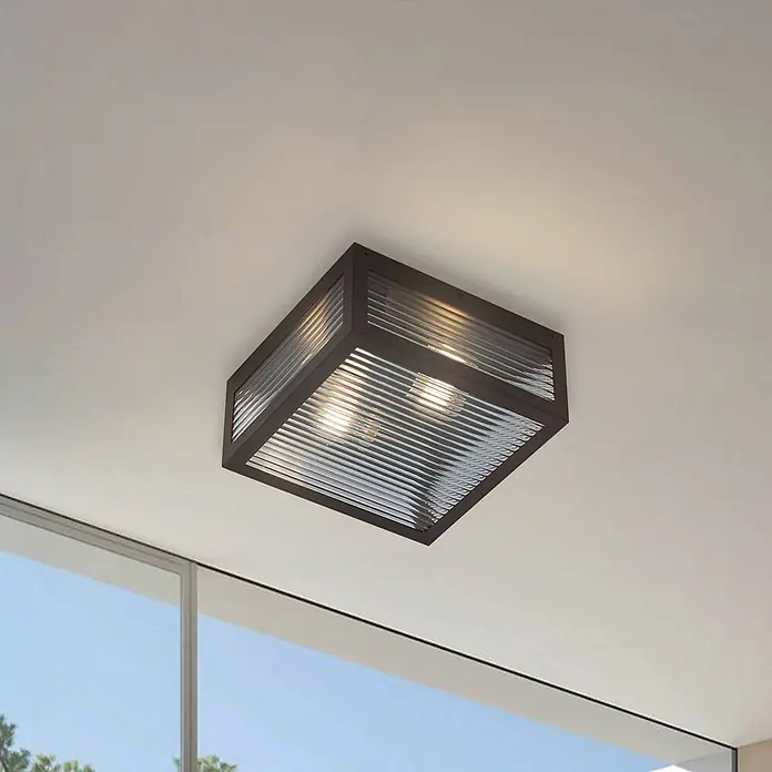Lindby Außenwand- & Deckenleuchte Bolgar - schwarz, IP44 - Dunkle quadratische Deckenleuchte mit gerippten Glasscheiben und beleuchteten Glühbirnen.