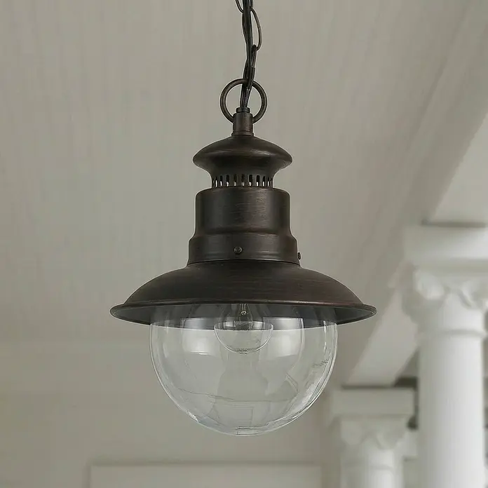 Lindby Außenwand- & Deckenleuchte Eddie - braun / rost, IP44 - Bronze Pendelleuchte im Außenbereich-Stil mit klarer Glaskugel, an einer Kette hängend.