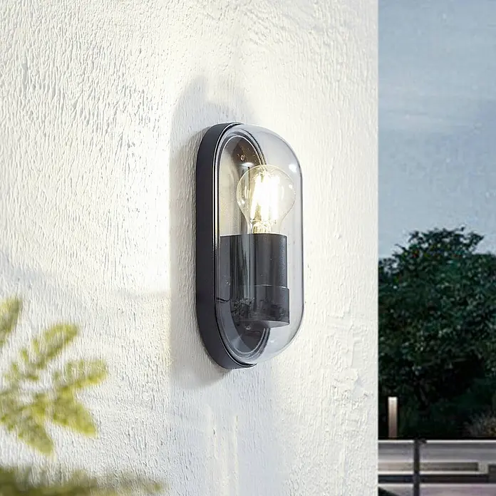 Lucande Außenwandleuchte Serine - schwarz, klar / transparent, IP65 - Schwarze Outdoor-Wandleuchte mit klarer, kapselartiger Glasabdeckung und glühender Birne.