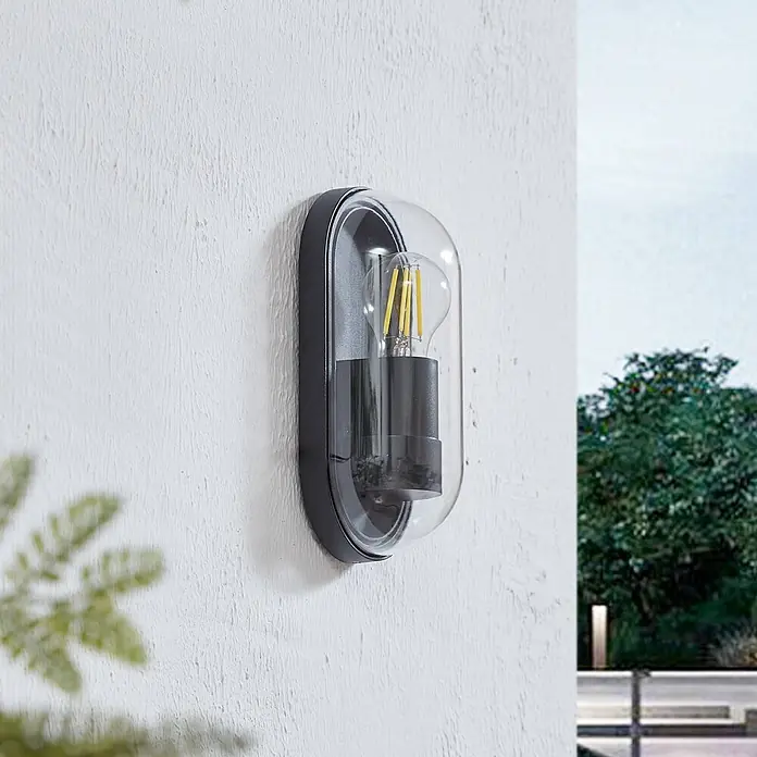 Lucande Außenwandleuchte Serine - schwarz, klar / transparent, IP65 - Schwarze ovale Außenwandleuchte mit klarer Abdeckung und LED-Filamentbirne.