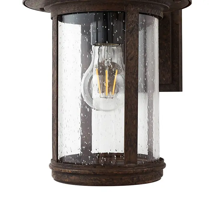 Lindby Außenwandleuchte Zayn - braun / rost, braun / rost, IP23 - Dunkelbronze-Außenwandleuchte mit Seeded-Glas und sichtbarer Edison-LED-Glühbirne.