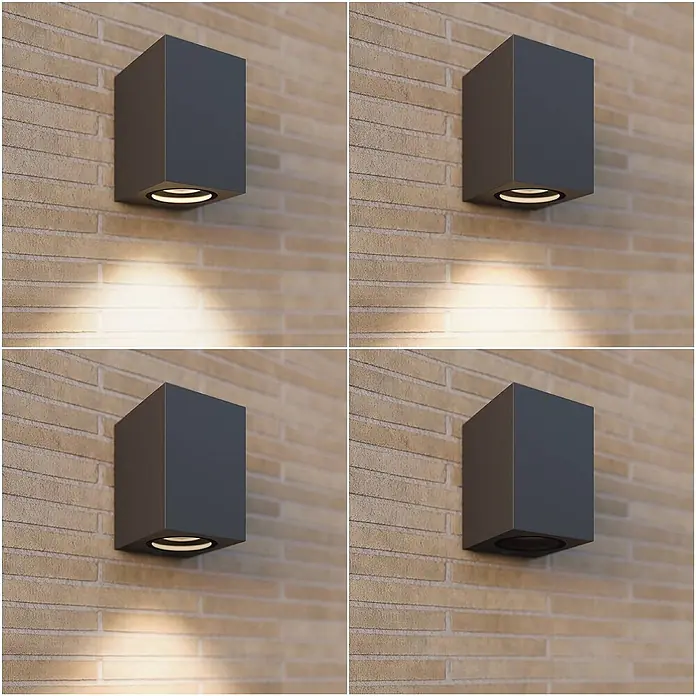 Lucande Außenwandleuchte Xava - schwarz, schwarz, IP65 - Dunkelgraue, kubische Außenwandleuchte an einer Ziegelwand, beleuchtet mit warmem Licht nach unten und unbeleuchtet dargestellt.