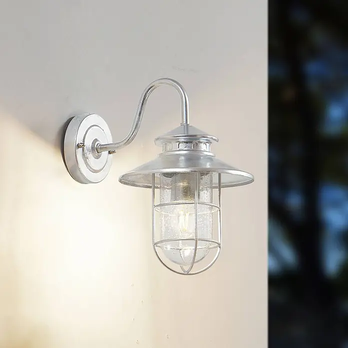 Lindby Außenwandleuchte Naleta - alu / grau / zink, IP44 - Silberne verzinkte Außenwandleuchte mit Klarglas und Käfig.