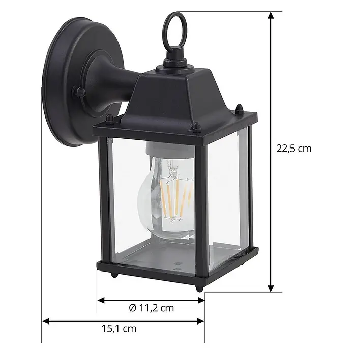 Lindby Außenwandleuchte Rurik - schwarz, IP44 - Schwarze Außenwandleuchte aus Metall mit klaren Glasscheiben im Laternen-Design, die eine LED-Filamentlampe zeigt.