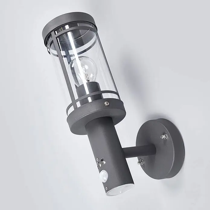 Lindby Außenwandleuchte Djori - alu / grau / zink, IP44 - Dunkelgraue Wandaußenleuchte mit klarem Glaszylinder, Glühbirne und integriertem Bewegungssensor.
