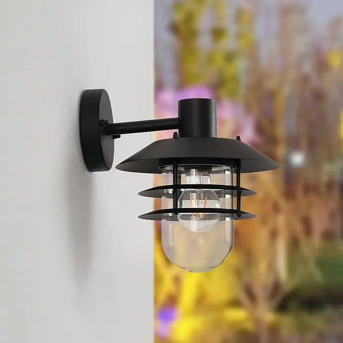 Lindby Außenwandleuchte Meliora - 25,4 x 21,6 x 26,2 cm, schwarz, klar / transparent, IP44 - Schwarze Außenwandleuchte mit klarem Glas und sichtbarer Glühbirne.
