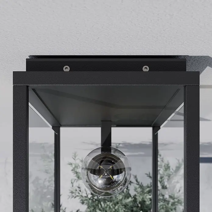Lucande Außenwandleuchte Annalea - schwarz, klar / transparent, IP54 - Schwarze, strukturierte Außen-Deckenleuchte im Laternen-Design, mit sichtbaren Schrauben und klarer kugelförmiger Glühbirne.