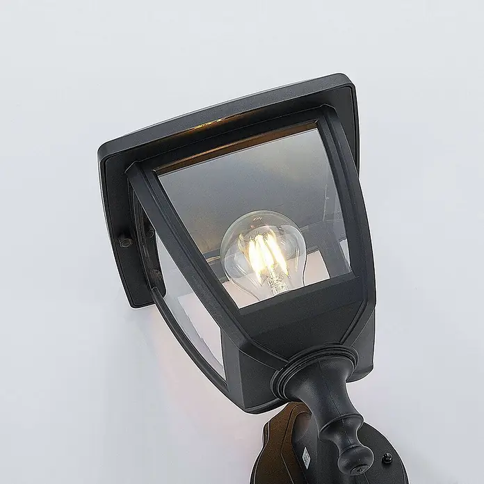 Lindby Außenwandleuchte Acelya - schwarz, schwarz, IP44 - Schwarze Wandleuchte für den Außenbereich mit klaren Glaspaneelen, die eine beleuchtete LED-Filamentlampe enthält.