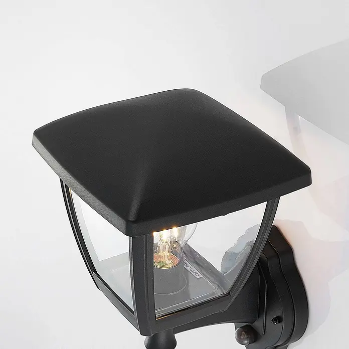 Lindby Außenwandleuchte Acelya - schwarz, schwarz, IP44 - Schwarze Wandaußenleuchte im Laternenstil mit Klarglas und sichtbarer Glühbirne.