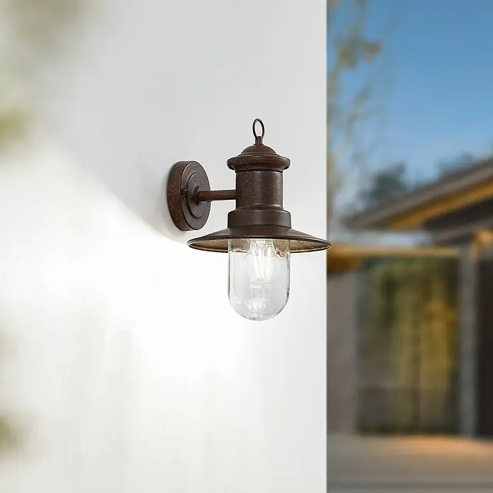 Lindby Außenwandleuchte Eloretta - braun / rost, braun / rost, IP44 - Rostbraune Außenwandleuchte mit klarem Glas und sichtbarer Glühbirne.