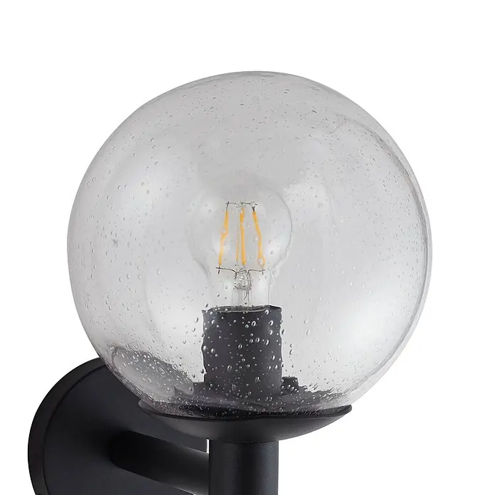 Lindby Außenwandleuchte Dangan - 26,1 x 20 x 28,8 cm, klar / transparent, IP44 - Schwarze Außenwandleuchte mit klarem, blasigem Glaskugel, die eine LED-Filamentbirne umschließt.