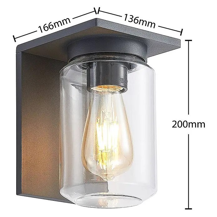 Lucande Außenwandleuchte Semka - schwarz, klar / transparent, IP54 - Dunkelgraue Metall-Wandleuchte mit Zylinder aus Klarglas und freiliegender Edison-Glühbirne. 200mm hoch, 166mm tief, 136mm breit.