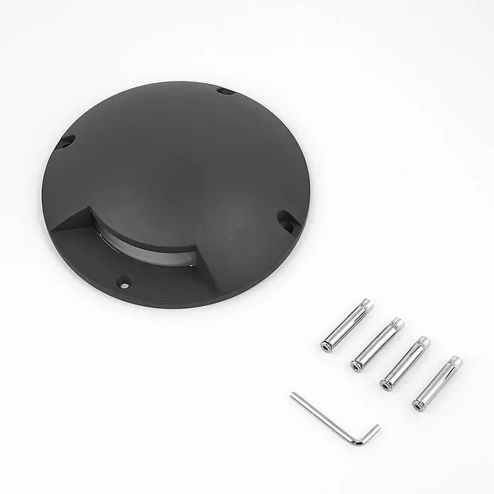 Lindby LED-Gartenstrahler Cormac - 3.000 K - Dunkelgraue runde LED-Bodeneinbauleuchte mit transparentem Streifen, dazu vier Metallanker und ein Innensechskantschlüssel.