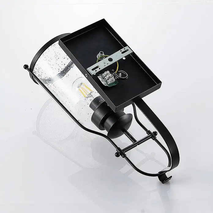 Lindby Wandleuchte Rozalie - L x B x H: 22 x 18 x 44 cm, schwarz, E27 - Schwarze Metall-Wandleuchte mit Glas mit Lufteinschlüssen und sichtbarer LED-Glühbirne, Montageplatte sichtbar.