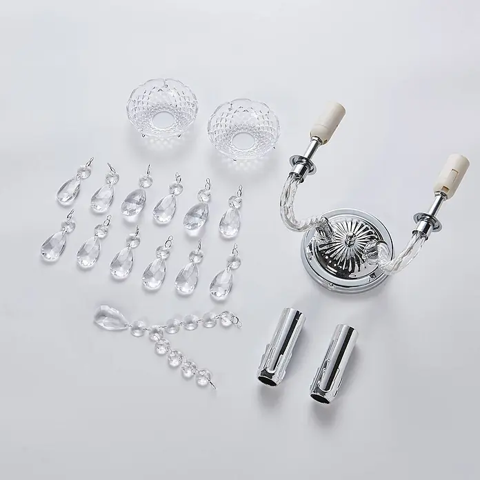Lindby Wandleuchte Merida - L x B x H: 18,5 x 33 x 35 cm, chrom / silber, klar / transparent, E14 - Montageteile für eine Kristall-Wandleuchte: Chrombasis mit zwei Fassungen, zwei gemusterte Glasschalen, mehrere klare Kristallanhänger und zwei Metall-Wanddübel.