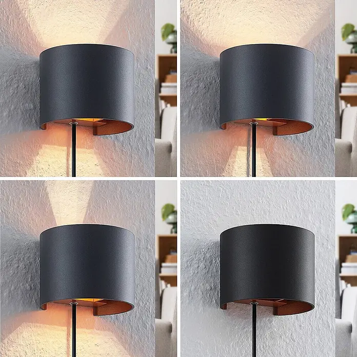 Arcchio Wandleuchte Zuzana - L x B x H: 11,2 x 13 x 9,7 cm, schwarz, G9 - Dunkelgraue zylindrische Wandleuchte mit Kupfer-Innenseite wirft warmes und kühles Licht auf eine strukturierte Wand.