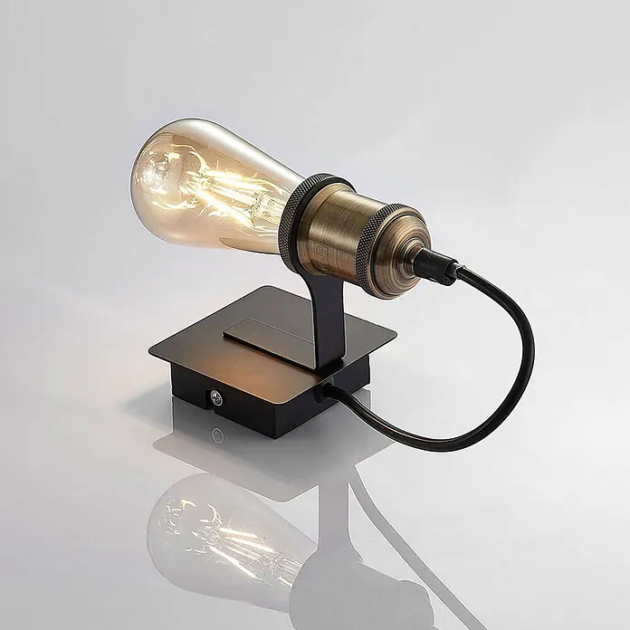 Lindby Wandleuchte Aurella - bronze / altmessing, E27 - Industrielle Wandleuchte mit glühender Edison-Birne, schwarzem quadratischem Sockel und antikem Messingfass.