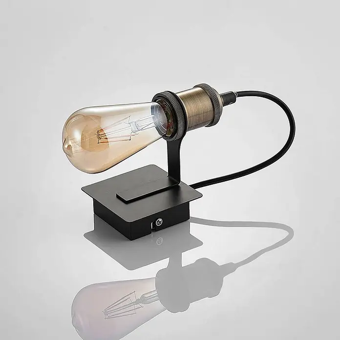 Lindby Wandleuchte Aurella - bronze / altmessing, E27 - Vintage-Tischlampe mit bernsteinfarbener Edison-Glühbirne, messingfarbener Fassung und schwarzem Metallfuß mit Schalter.