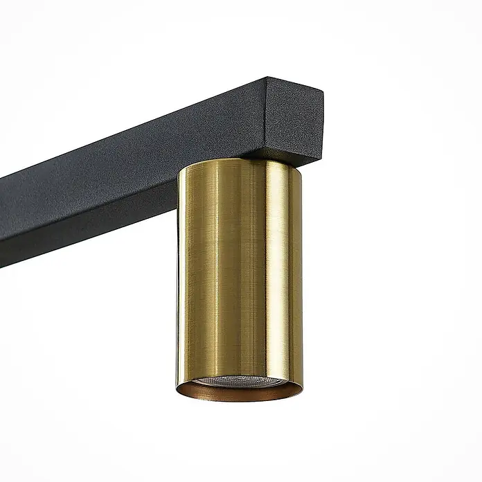 Lindby Pendelleuchte Baliko - messing, Schwarz, GU10 - Goldener zylindrischer Strahler an einer schwarzen Rechteck-Schiene.