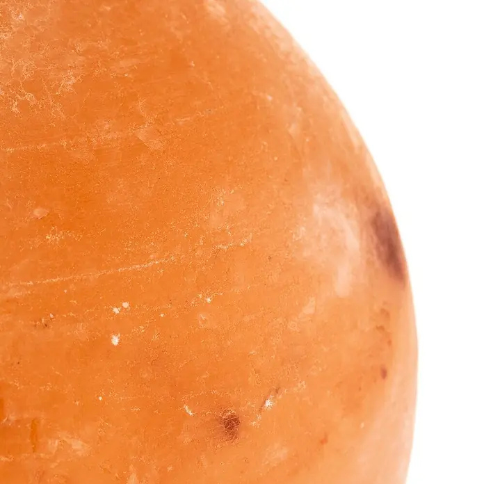 Envostar Tischleuchte Harmony - rot, E14 - Nahaufnahme einer natürlichen orangefarbenen, rauen und gekrümmten Oberfläche mit helleren und dunkleren Texturen.