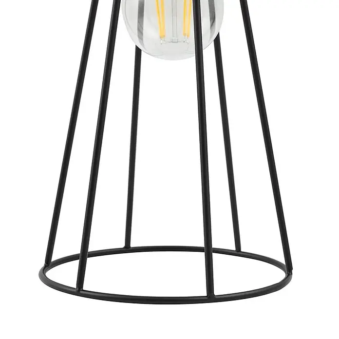 Lindby Tischleuchte Tharion - L x B x H: 15,4 x 15,4 x 42,6 cm, schwarz, E27 - Nahaufnahme eines schwarzen Metallkäfig-Lampenfußes mit klarer Glühbirne.