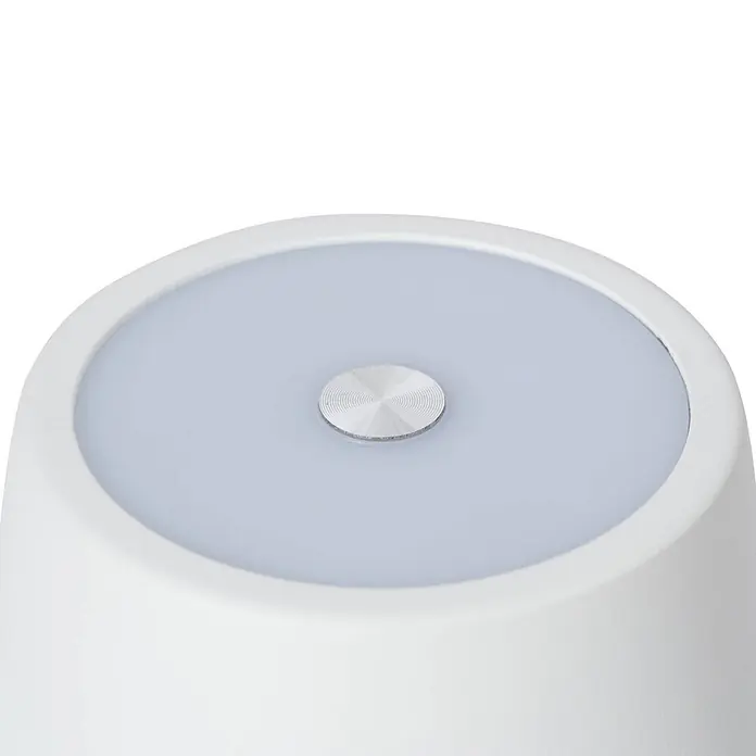 Lindby Tischleuchte Janea - weiß / opal, weiß / opal - Weiße Lampe mit einer lichtgrauen, transluzenten Oberseite und einem zentralen, strukturierten Metallknopf.
