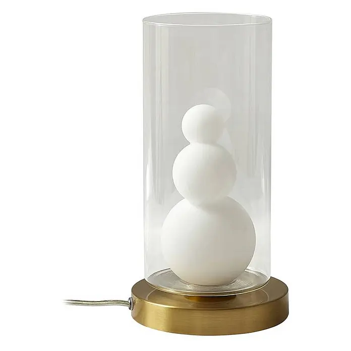 Lindby Tischleuchte Kupla - L x B x H: 15 x 15 x 28,5 cm, messing / gold, klar / transparent, G9 - Moderne Tischlampe mit klarem Glaszylinder, Messingsockel und drei gestapelten weißen Kugelleuchten im Inneren.
