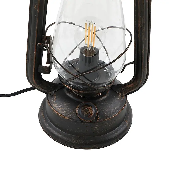 Lindby Tischleuchte Raisa - braun / rost, E14 - Elektrische Laterne im Vintage-Stil mit gealtertem dunklem Metall-Finish, klarem Glas und sichtbarer LED-Glühbirne.