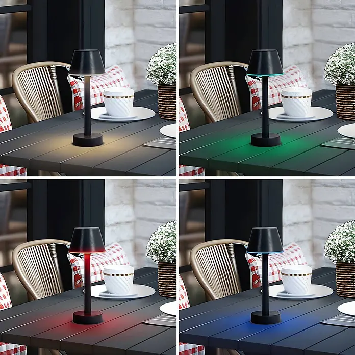 Lindby Tischleuchte Gaja - schwarz, schwarz - Schwarze LED-Tischleuchte mit gelben, grünen, roten und blauen Lichteinstellungen auf einem Gartentisch.