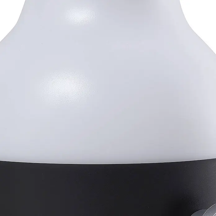 Lindby Tischleuchte Isaline - schwarz, weiß / opal - Abgerundetes Objekt mit texturierter weißer Oberseite und dunkelgrauer Basis, mit einem kleinen silbernen Detail.