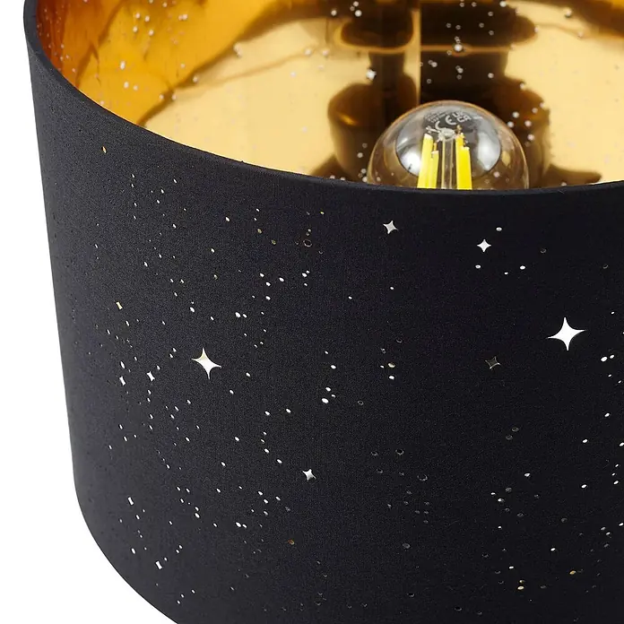Lindby Tischleuchte Arved - L x B x H: 30 x 30 x 46 cm, schwarz, schwarz, E27 - Schwarzer Lampenschirm aus Stoff mit Sternperforationen und goldener Innenseite, die eine Glühbirne zeigt.