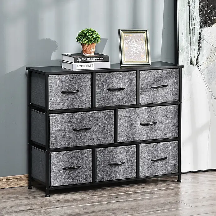 Homcom Kommode 1-teilig - L x B x H: 100 x 30 x 78,5 cm, Schwarz, dunkelgrau, Anzahl Schubladen: 8 Stk. - Eine schwarze Kommode mit 8 grauen Stoffschubladen und schwarzem Gestell, darauf eine Pflanze und Bücher.