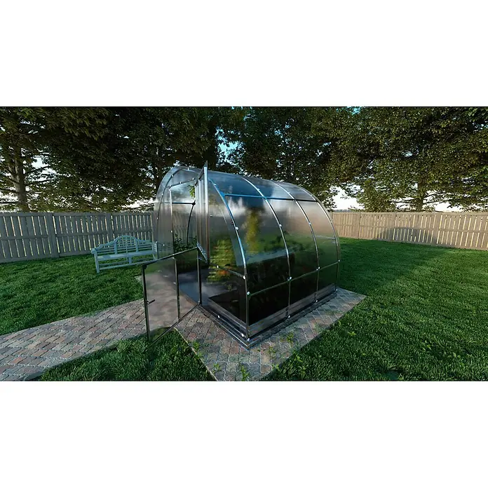 Klasika Greenhouses Gewächshaus Tube Klasika - Außenmaß inkl. Dachüberstand (B x T): 300 x 200 cm, Material Seitenwand: Kunststoff, 6 mm, Silbergrau - Gewölbtes transparentes Gewächshaus mit Metallrahmen und offener Tür, auf einem gepflasterten Weg.