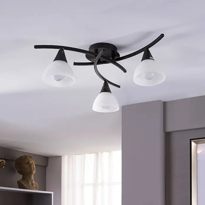 Lindby Deckenleuchte Della - schwarz, E14 - Deckenleuchte mit drei Spots in Bronze-Optik, geschwungenen Armen und weißen Glasdiffusoren.