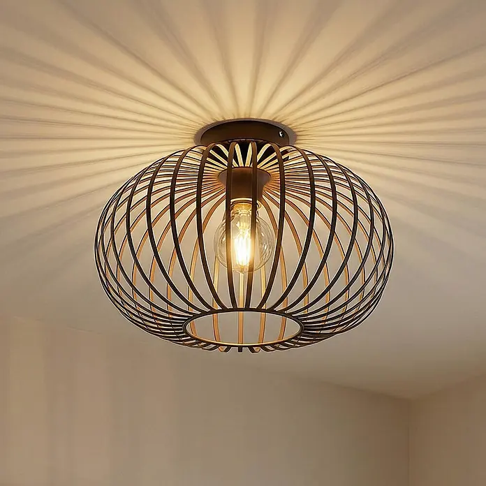 Lindby Deckenleuchte Nahele - braun / rost, braun / rost, E27 - Schwarze Deckenleuchte aus Metallgeflecht mit sichtbarer Glühbirne, die Sonnenstrahlschatten an die Decke wirft.