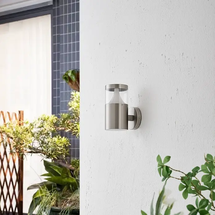 Arcchio Außenwandleuchte Rudolfine - alu / grau / zink, alu / grau / zink, IP54 - Gebürstete Edelstahl-Außenwandleuchte mit klarem Zylinder und weißem Diffusor.