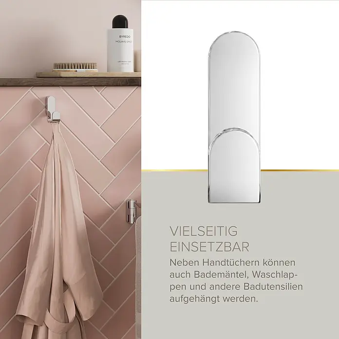 Lenz Aura Handtuchhaken - 1-armig, Verchromt - Glänzender Chrom-Doppelhaken, der einen rosafarbenen Bademantel an einer gefliesten Badwand hält.